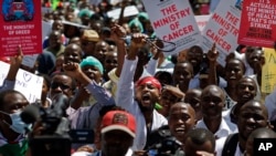 FILE - A striking Kenyan doctor holds his stethoscope in the air as he and other medical staff demonstrate in Nairobi on Feb. 15, 2017. Kenyan doctors began another strike on March 15, 2024, accusing the government of failing to fulfill promises from the 2017 strike.