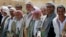 FILE - Pro-government tribesmen attend a tribal gathering to denounce the deployment of militants of the Shi'ite Houthi group, near Amran city, the capital of Amran province north of the Yemeni capital Sanaa, April 13, 2014.