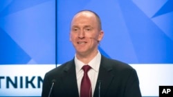 FILE - Carter Page, a former foreign policy adviser to U.S. President-elect Donald Trump, speaks at a news conference at RIA Novosti news agency in Moscow, Russia, Dec. 12, 2016. Page's ties to Russian officials are currently under investigation.