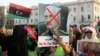 Libyan protesters attend a demonstration to demand an end to the Khalifa Haftar's offensive against Tripoli, in Martyrs' Square in central Tripoli, Libya, April 19, 2019.