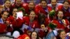Team Canada players pose with their gold medals during the presentation ceremony after Canada defeated Team USA in overtime in the women's ice hockey final game at the 2014 Sochi Winter Olympics, Feb. 20, 2014.
