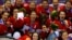 Team Canada players pose with their gold medals during the presentation ceremony after Canada defeated Team USA in overtime in the women's ice hockey final game at the 2014 Sochi Winter Olympics, Feb. 20, 2014.