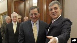 U.S. Sec. of Defense Leon Panetta, center, is greeted by Turkish President Abdullah Gul, right, before the start of their meeting in Ankara, Turkey, Dec., 16, 2011.