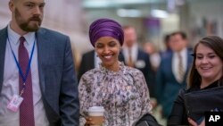 Rep. Ilhan Omar, D-Minn., walks through an underground tunnel at the Capitol as top House Democrats plan to offer a measure that condemns anti-Semitism in the wake of controversial remarks by the freshman congresswoman, in Washington, March 6, 2019.