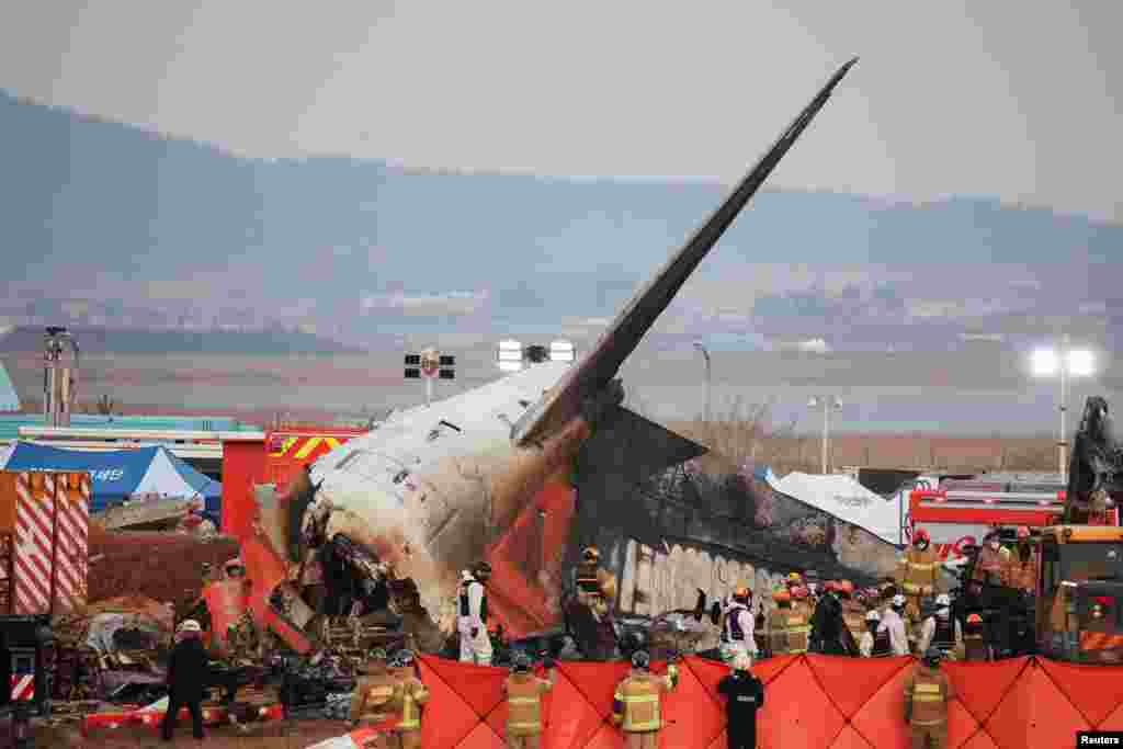 Rescue workers work at the Jeju air plane&nbsp;crash site at Muan International Airport, Dec. 29, 2024.