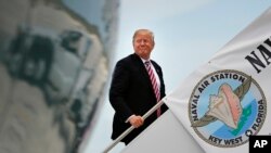 President Donald Trump boards Air Force One before his departure from Naval Air Station Key West in Key West, Florida, April 19, 2018. 