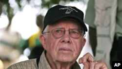 Former US president Jimmy Carter visits a polling station in Juba in southern Sudan, 13 Apr 2010