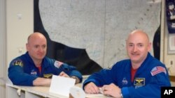 Astronauts Mark Kelly (right) and twin Scott Kelly (left) will rendezvous at the International Space Station in late February 2011.