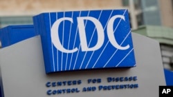 FILE - A sign identifies the Centers for Disease Control and Prevention in Atlanta, Georgia, on March 15, 2020. The Trump administration has frozen many federal health agency communications — including a weekly publication by the CDC — through at least the end of the month.