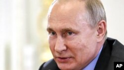 Russian President Vladimir Putin speaks during a meeting with heads of world's leading news agencies at the St. Petersburg International Economic Forum in St. Petersburg, Russia, June 6, 2019.