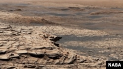 This photo, compiled from 28 images, shows the view from NASA’s Curiosity Mars rover on April 9, 2020. It shows the landscape of the Stimson sandstone formation in Gale Crater. (Photo Credit: NASA/JPL-Caltech/MSSS)