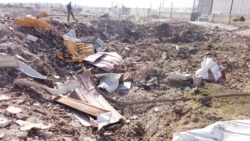 FILE - General view of the debris of the Ukrainian plane that was shot down on the outskirts of Tehran, Jan. 8, 2020. (Screen grab obtained from a social media video via Reuters).