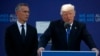 NATO Secretary General Jens Stoltenberg listens as President Donald Trump speaks during a ceremony to unveil artifacts from the World Trade Center and Berlin Wall for the new NATO headquarters in Brussels, May 25, 2017. 