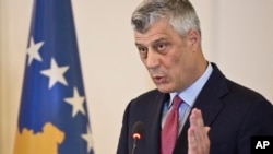 FILE - Kosovo president Hashim Thaci reacts during a press conference in capital Pristina, Kosovo, March 8, 2017. 