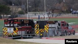 Emergency responders are seen near a synagogue where a man has reportedly taken people hostage during services in Colleyville, Texas, Jan. 15, 2022. 