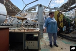 Galyna Tolstolutska, head of the department of radiation damage and radiation materials science of the National Scientific Center "Kharkov Institute of Physics and Technology" stands at her department that's heavily damaged by a Russian attack, May 18, 2023. (AP/Oleksandr Brynza)
