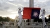 FILE - Two soldiers fold the national flag during the daily flag ceremony in Liberty Square of Chiang Kai-shek Memorial Hall in Taipei, Taiwan, on July 30, 2022.