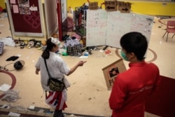Protesters walk inside Hong Kong Polytechnic University, in Hong Kong, Nov. 23, 2019.