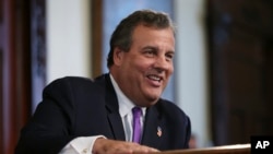 New Jersey Gov. Chris Christie laughs at a question from the media after speaking in Trenton, N.J. Donald Trump is pledging that the government he appoints will bring sweeping change to Washington’s culture, Aug. 29, 2016 file photo.