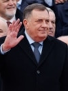 Bosnia's member of tripartite presidency Milorad Dodik waves to people during parade celebrations to mark their autonomous Serb Republic's national holiday, in Banja Luka