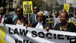 Mercy Wambua (C), CEO of the Law Society of Kenya, and other lawyers march to demand that court orders and the law are respected, following the government's deportation last week of an opposition politician in defiance of a court order that he be produced in court, in downtown Nairobi, Kenya, Feb. 15, 2018. 