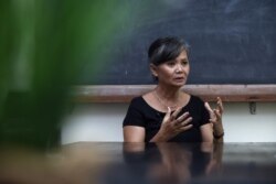 FILE - Now dissolved Cambodia National Rescue Party (CNRP) deputy leader Mu Sochua gestures during an interview at an undisclosed location in Bangkok, Thailand, Oct. 5, 2017.