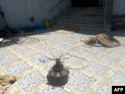 FILE - This undated handout photo obtained July 15, 2020, courtesy of AFRICOM, shows a verified image of a booby-trapped anti-personal mine connected to the Russia-financed Wagner Group, found in a residential area in Tripoli.