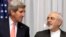 FILE - U.S. Secretary of State John Kerry, left, listens to Iran's Foreign Minister Mohammad Javad Zarif, right, before resuming talks over Iran's nuclear program in Lausanne, Switzerland.