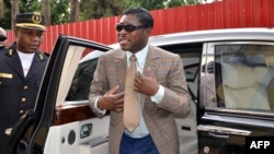 Teodorin Nguema Obiang (R), the son of Equatorial Guinea's president Teodoro Obiang and the country's vice president in charge of security and defense, arrives at Malabo's Cathdral to celebrate his 41st birthday, June 25, 2013. 