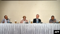 FILE - Members of the Independent Commission of Inquiry for Rakhine are seen at a press briefing in Myanmar's capital Naypyidaw, Aug. 16, 2018.