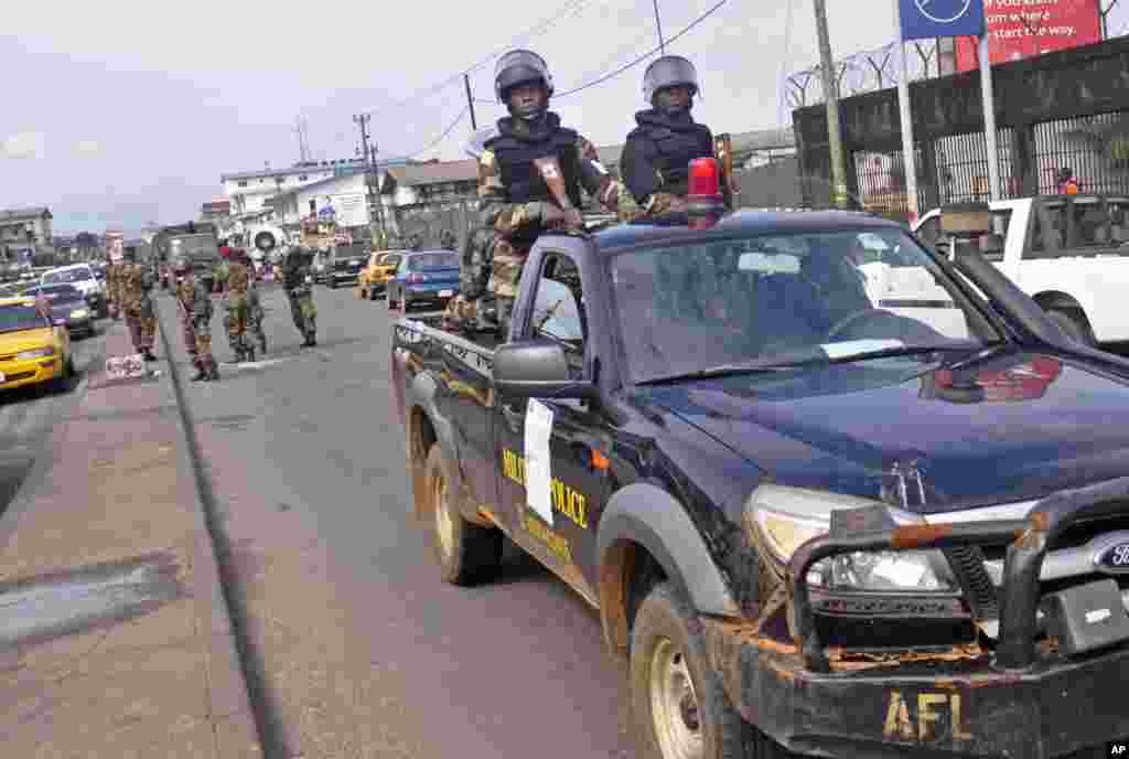 Liberian soldiers patrol the streets on foot and in vehicles to help prevent panic, Monrovia, Liberia, August 1, 2014.