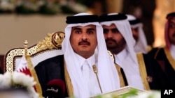FILE- In this Dec. 9, 2014, file photo, Qatar's Emir Sheikh Tamim bin Hamad Al-Thani attends a Gulf Cooperation Council summit in Doha, Qatar.