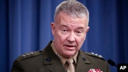 FILE - In this April1 14, 2018, file photo, then-Marine Lt. Gen. Kenneth "Frank" McKenzie speaks during a media availability at the Pentagon in Washington. 