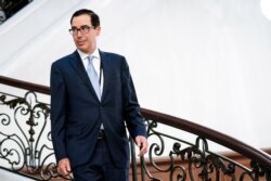U.S. Treasury Secretary Steven Mnuchin walks to a working breakfast at the G7 Summit in Biarritz, France, Aug. 25, 2019.