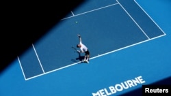 FILE - Spain's Pedro Martinez in action during his first round match against Poland's Hubert Hurkacz, Melbourne Park, Melbourne, Autralia, Jan. 16, 2023.