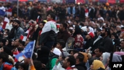 Iraq supporters gather in a designated fan zone in Iraq's southern city on Jan. 16, 2023 to watch the Arabian Gulf Cup semi-final football match between Iraq and Qatar. 