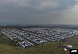 The new arrivals were forced from homes farther north by the advancing M23 militia, which resumed fighting in November 2021 after accusing the Congolese government of failing to honor an agreement to incorporate its fighters into the army. (This aerial view shows the internally displaced persons camp in Bushagara, north of the city of Goma in eastern Democratic Republic of Congo, Jan. 13, 2023.)