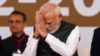 Perdana Menteri India Narendra Modi menyapa hadirin dalam upacara pelantikan Ketua Menteri Gujarat Bhupendra Patel, di Gandhinagar, India, 12 Desember 2022. (Foto: AP)