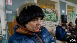 Speaking in a bunker, Lyudmyla Malynovska says information is sparse in the area plagued by shortages of electricity, water, heat and network connections, in Bakhmut, Ukraine, Jan. 20, 2023. (Yan Boechat/VOA)