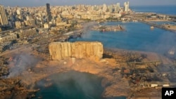 FILE - A drone picture shows the scene of an explosion that hit the seaport of Beirut, on Aug. 5, 2020. 