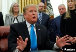 U.S. President Donald Trump speaks in the Oval Office at the White House in Washington, Feb. 19, 2019.