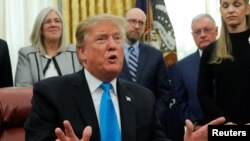 FILE - U.S. President Donald Trump speaks in the Oval Office at the White House in Washington, Feb. 19, 2019. 