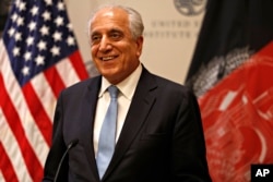 FILE - Special Representative for Afghanistan Reconciliation Zalmay Khalilzad approaches the microphone to speak on the prospects for peace, Feb. 8, 2019, at the U.S. Institute of Peace, in Washington.