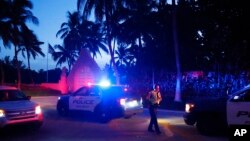 Police direct traffic outside an entrance to former President Donald Trump's Mar-a-Lago estate, in Palm Beach, Fla., Aug. 8, 2022.