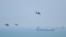 Chinese military helicopters fly past Pingtan Island on August 4, 2022, ahead of massive military drills off Taiwan. Pingtan Island is part of Fujian Province and one of China's closest points to Taiwan. (Hector Retamal/AFP