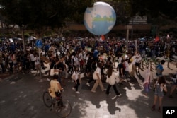 Activists participate in a climate march in Tel Aviv, Israel, Oct. 28, 2022, and call on the government to take action to reduce greenhouse gas emissions to limit the impact of climate change. The march took place less than two weeks before the start of the global COP27 climate conference in Sharm el-Sheikh, Egypt.