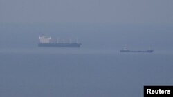 Grain ships carrying Ukrainian grain are seen in the Black Sea, amid Russia's attack on Ukraine, near Ukrainian port of Odesa, Ukraine, Oct. 30, 2022. 