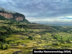 Waterfalls plunge down the face of Guinea's Mount Gangan. It's the kind of tropical paradise that tourists would flock to, but its tourism sector has not yet been developed.