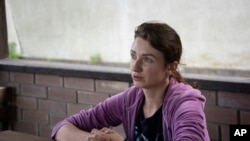 Viktoria Skliar is interviewed by the Associated Press at the stables, named "Magnat" in the Kyiv region, Ukraine, Monday Aug. 8, 2022. 