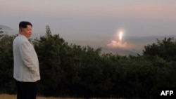 This undated picture released from North Korea's official Korean Central News Agency (KCNA) on Oct. 10, 2022, shows North Korea's leader Kim Jong Un monitoring a North Korean missile launch at an undisclosed location.